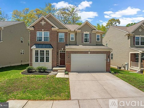 A house with a garage is for sale.