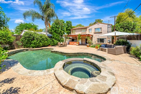 A house with a pool in the backyard.