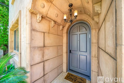 A grey door is on the right side of the image.