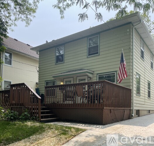 A house with a deck and an American flag.