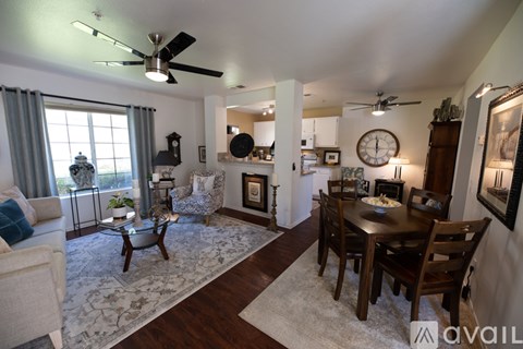 A living room with a dining table and chairs.