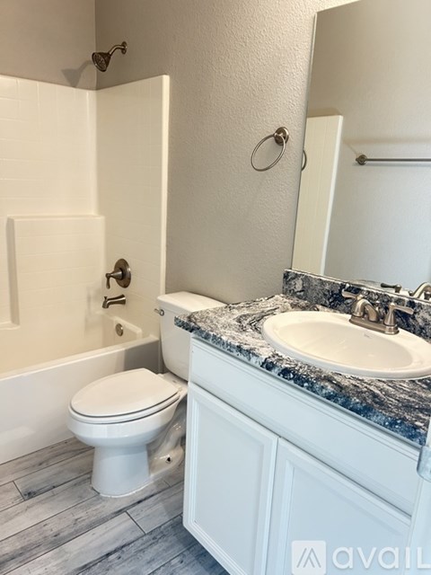 A spacious kitchen with a white island in the middle.