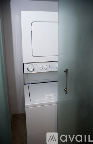 A white oven and stove top are in a kitchen.