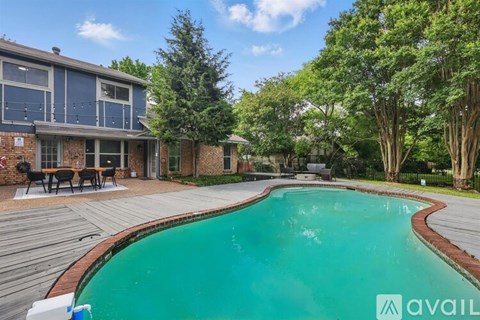 A house with a pool in the backyard.