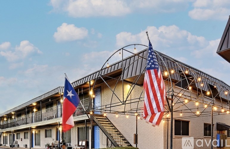 A building with an American flag and a Chilean flag on flagpoles.
