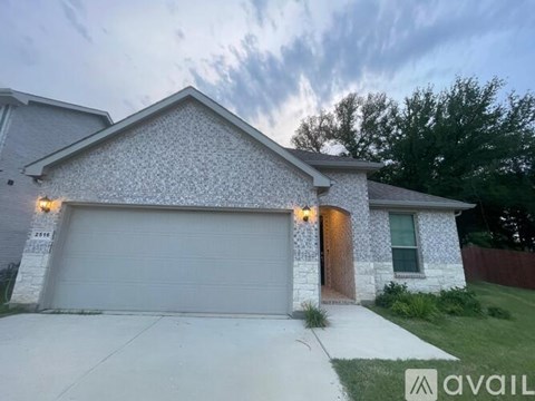 A house with a garage is available for sale.