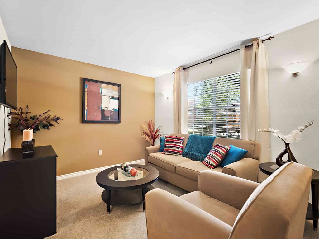 a living room with a couch and a table