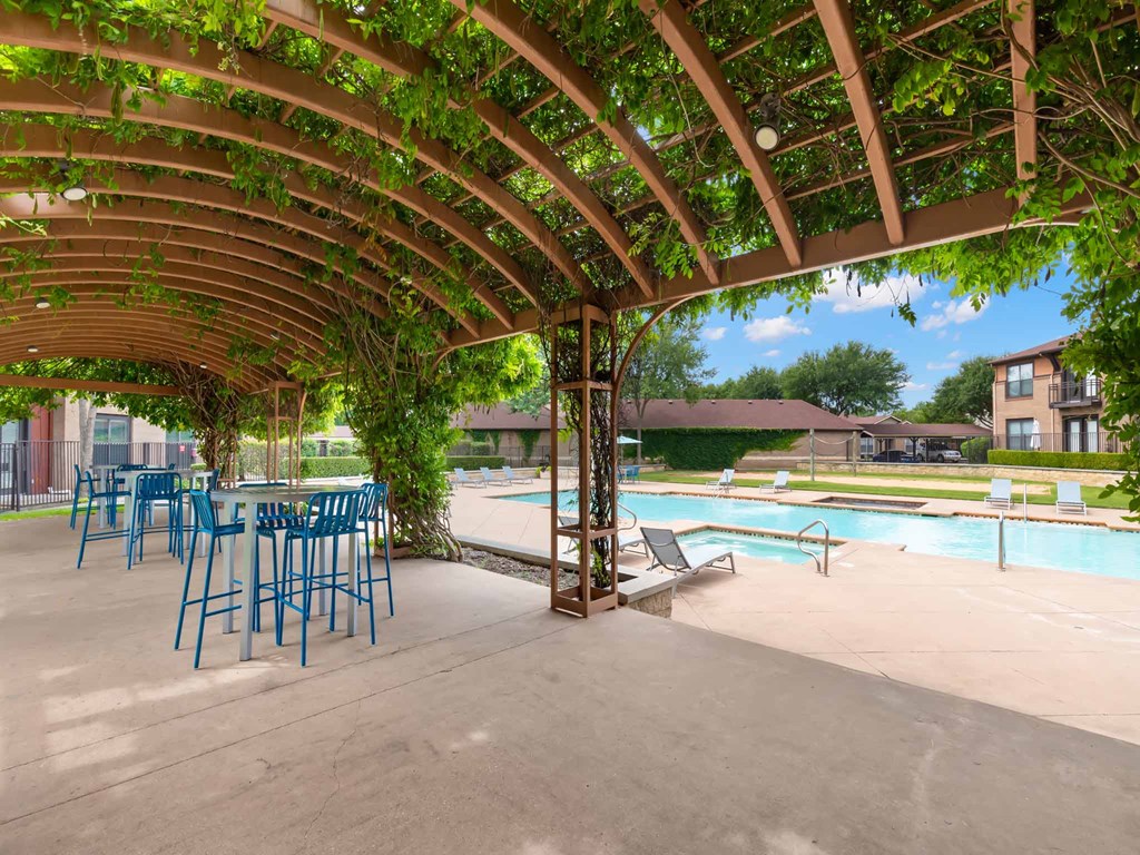 our apartments have a pool and covered patio with chairs