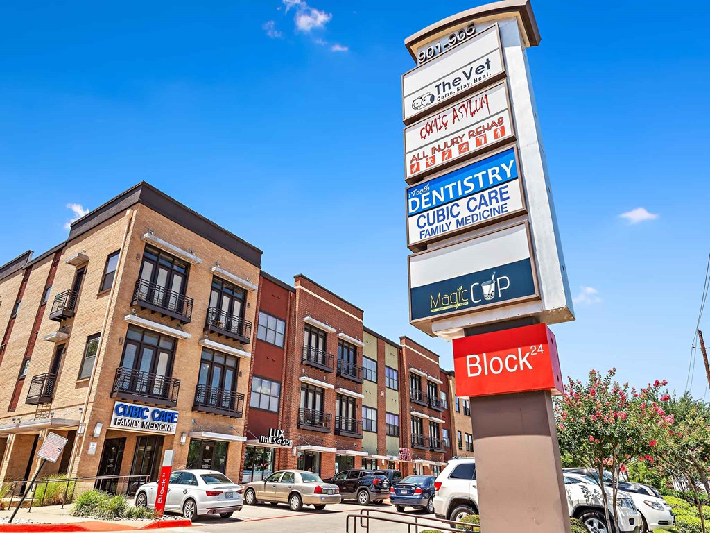 a sign for a dentist office in front of a building