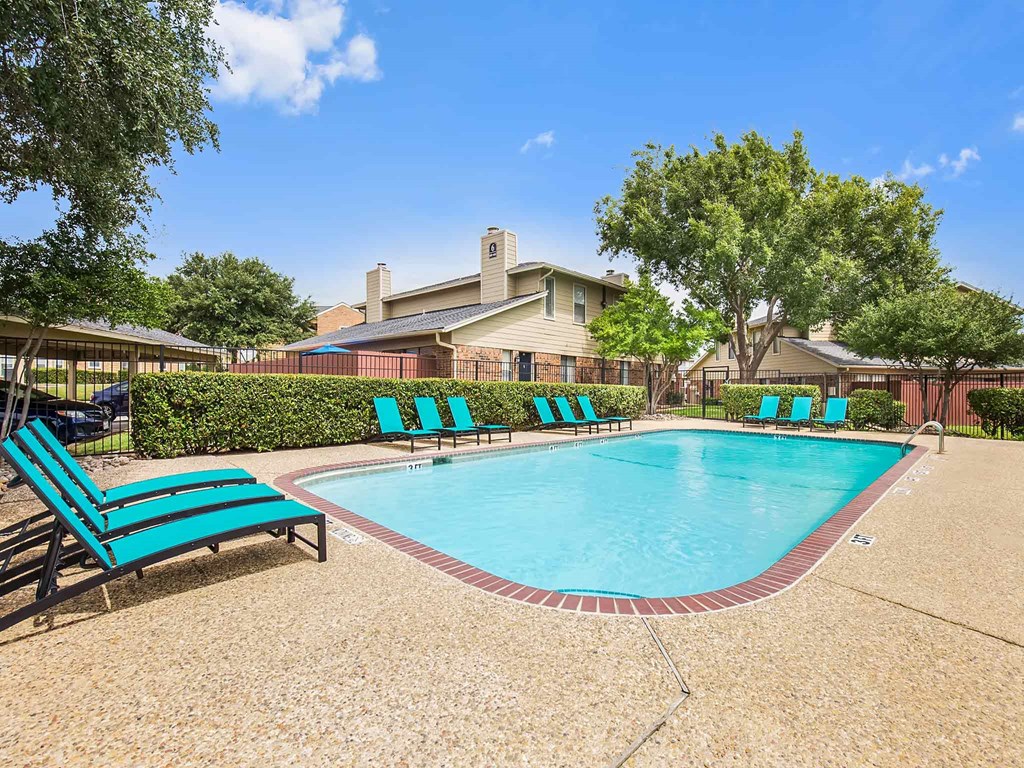 our apartments have a resort style pool and lounge chairs