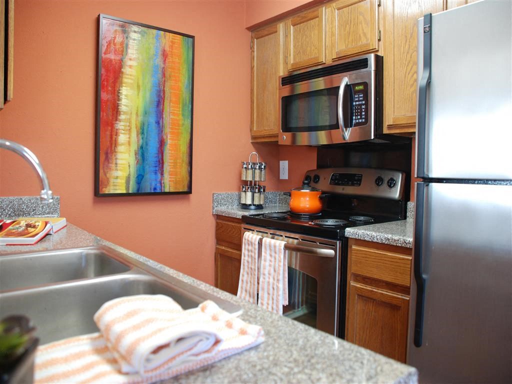 a kitchen with stainless steel appliances and a sink