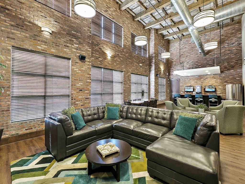 an office lobby with couches and chairs and a table
