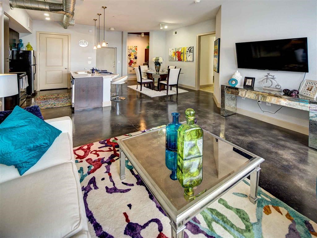 a living room with a couch and a table