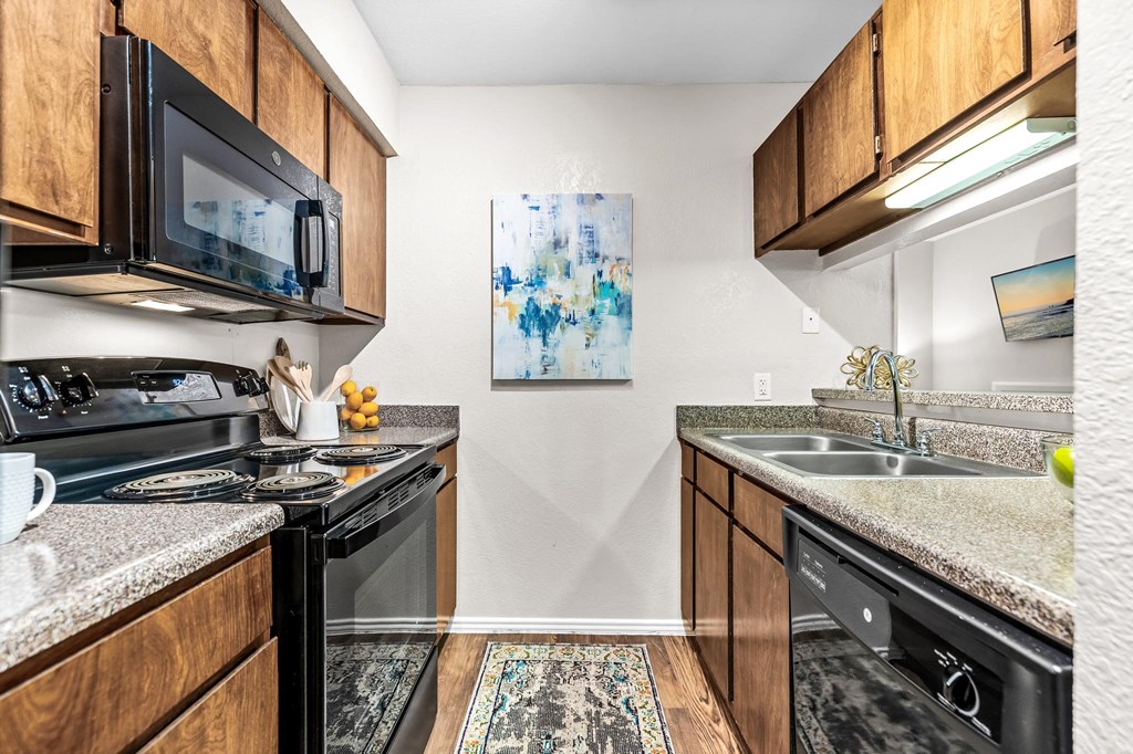 our spacious kitchens are equipped with stainless steel appliances and wood cabinets
