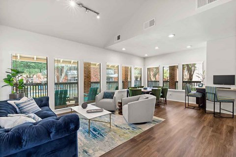 a living room with a blue couch and a tv
