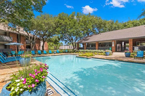 a large swimming pool in front of a house