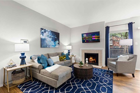 a living room with a couch and a fireplace