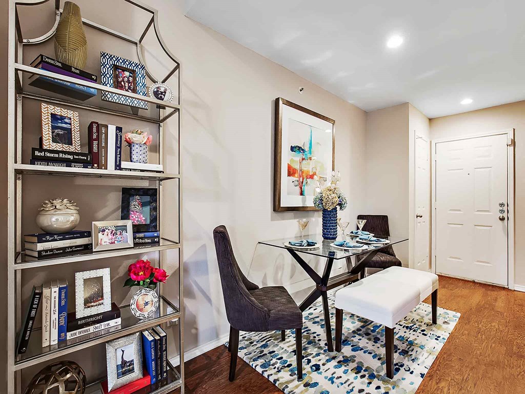 a home office with a desk and a bookshelf