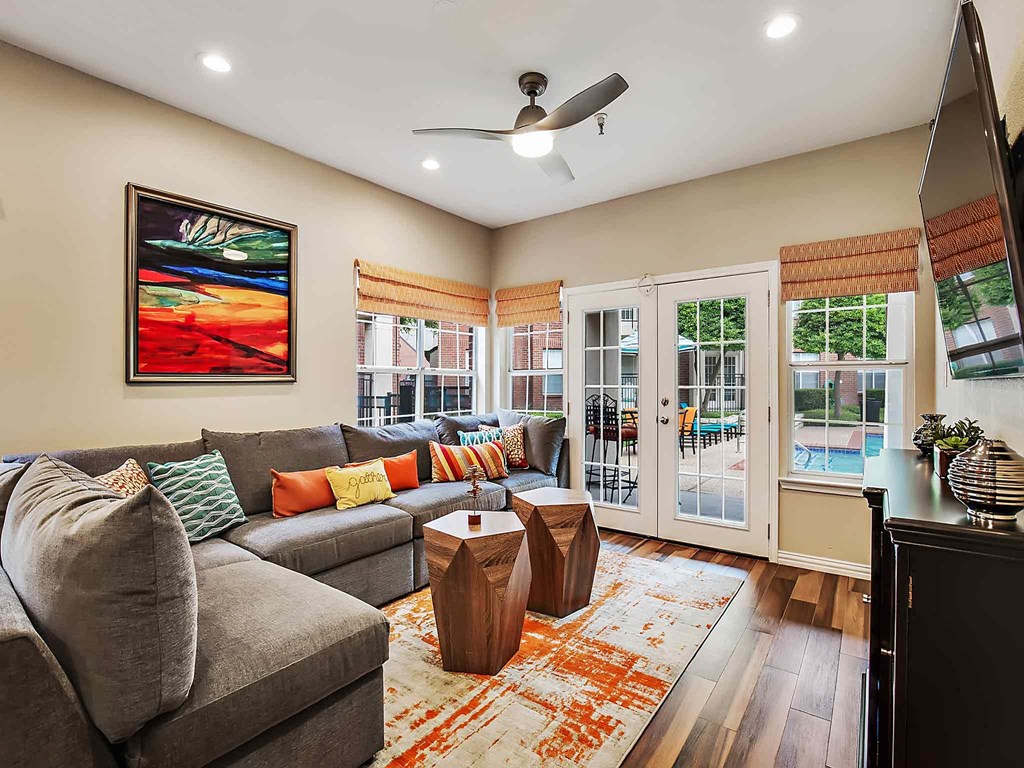 a living room with a gray couch and a coffee table