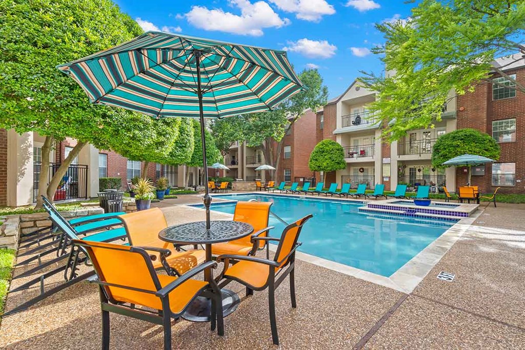 our apartments offer a swimming pool with chairs and umbrellas