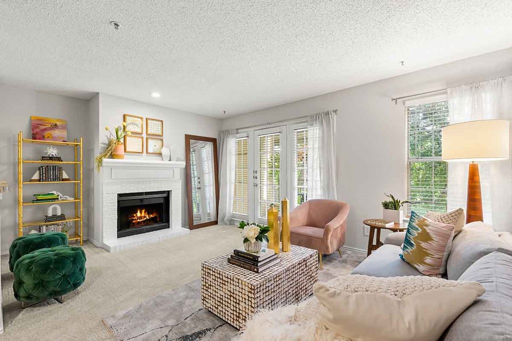 a living room with a fireplace and a couch