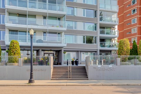 The image shows a modern building with the name "Fairmont" on the entrance.