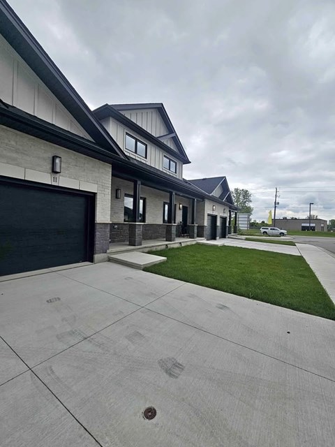 A modern building with a grey garage door.
