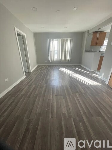 A room with a marble floor and a white door.