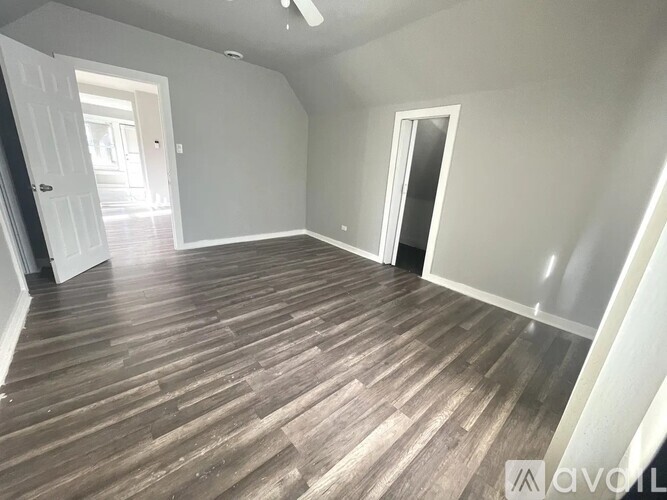 A room with a window and a light on.