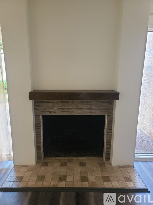 A fireplace in a room with a tiled floor.