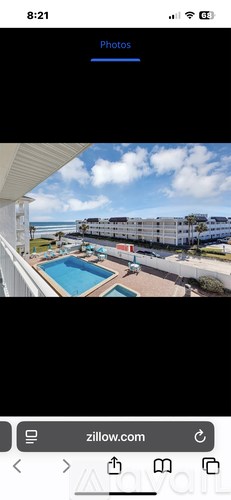 A view of a pool area from a balcony.