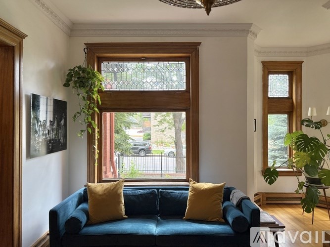 A kitchen with dark brown cabinets and a white countertop.