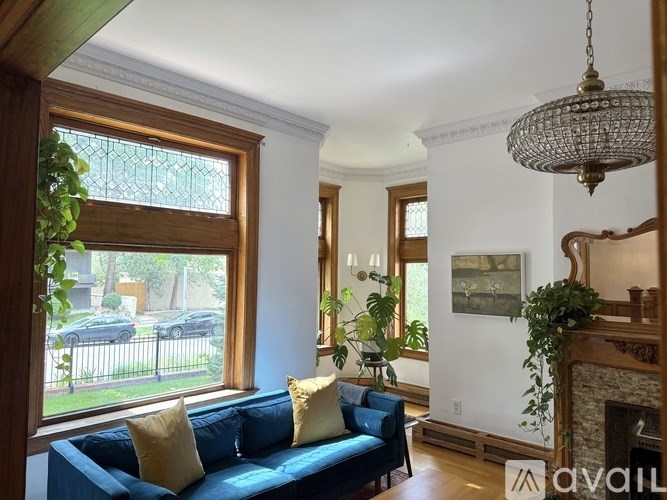 A modern kitchen with dark wood cabinets and stainless steel appliances.