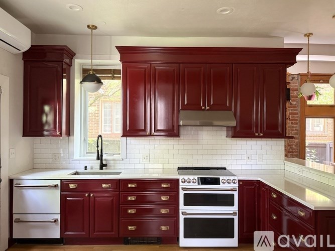 A backyard with a patio and a fire pit.