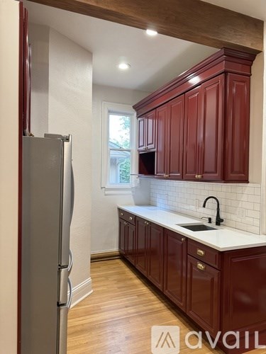 A patio with a table and chairs under an umbrella.