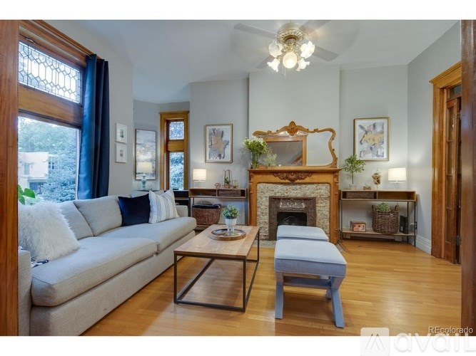 A living room with a fireplace and a couch.