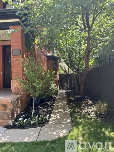 A living room with a fireplace and a couch.
