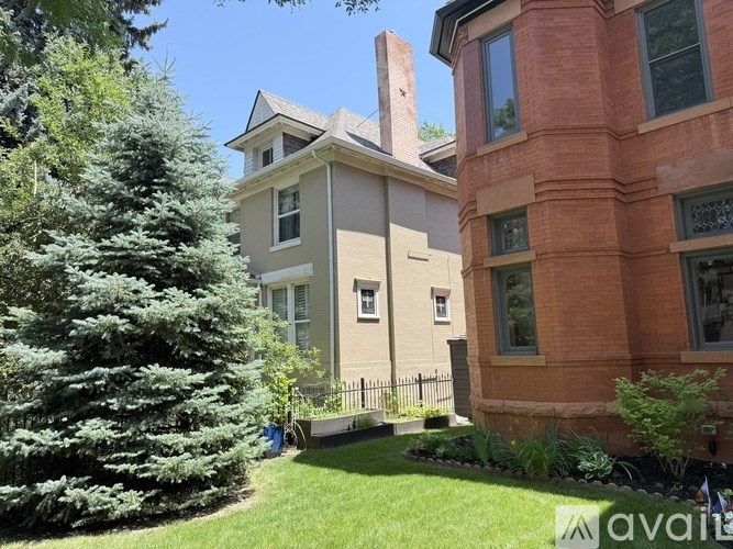 A living room with a fireplace and a couch.