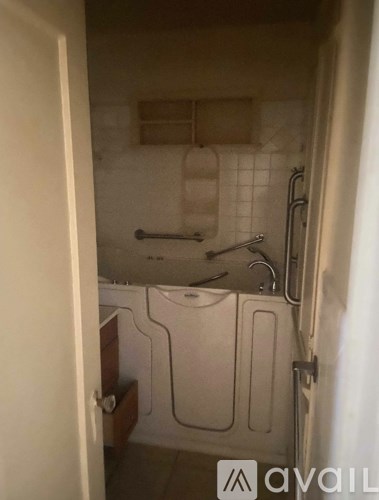 A bathroom with a toilet, sink, and shower.