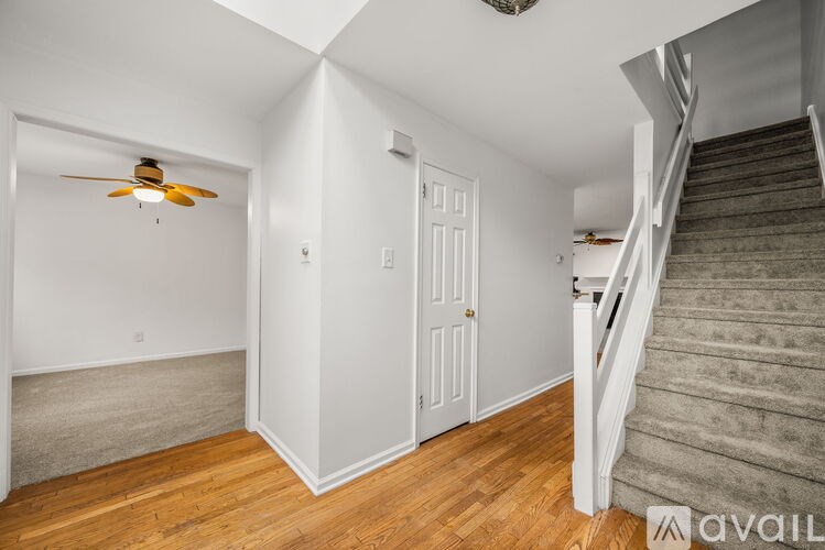 A room with a staircase leading to the upper floor.