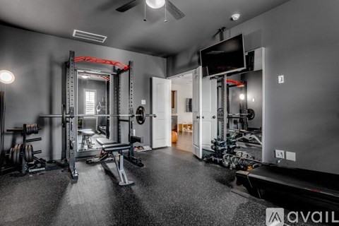 A well-equipped home gym with a variety of exercise equipment.