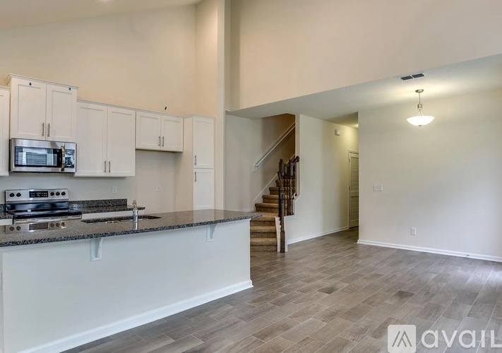 A kitchen with a stove top oven and microwave.