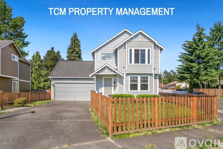A house with the text "TCM PROPERTY MANAGEMENT" in front of it.