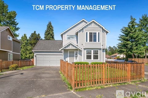 A house with the text "TCM PROPERTY MANAGEMENT" in front of it.
