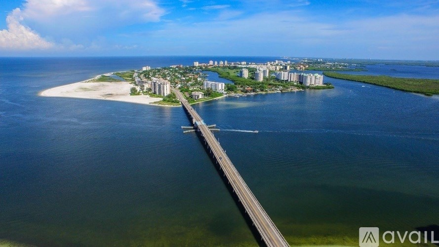 A bridge spans a body of water connecting two land masses.