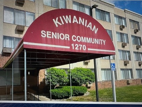 A red sign that says Kiwanian Senior Community 1270.