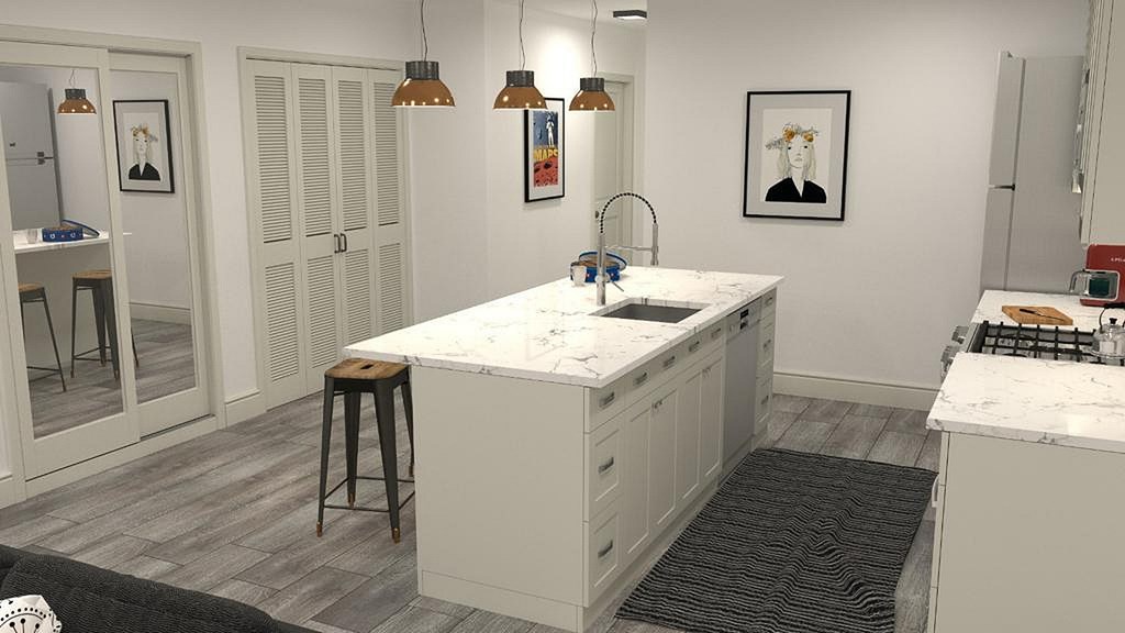 A kitchen with a white countertop and a bar stool.