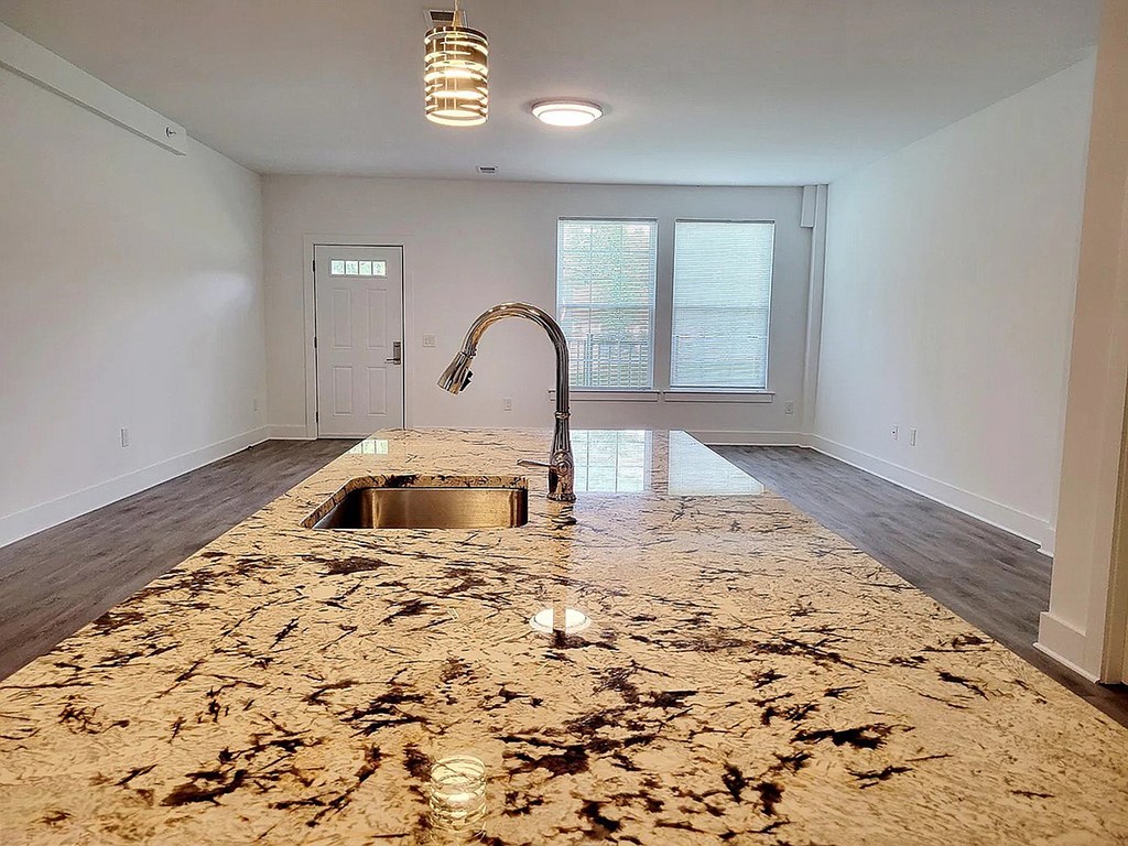 A kitchen with a sink and a window.
