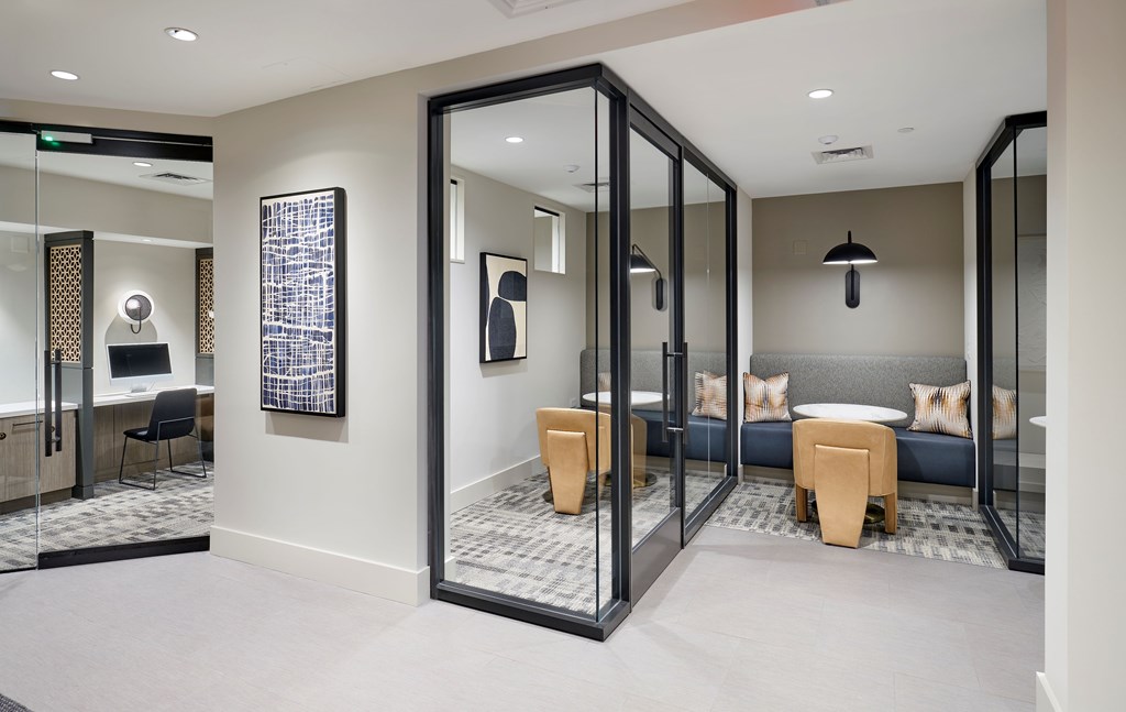 A room with a mirrored wall and a couch.