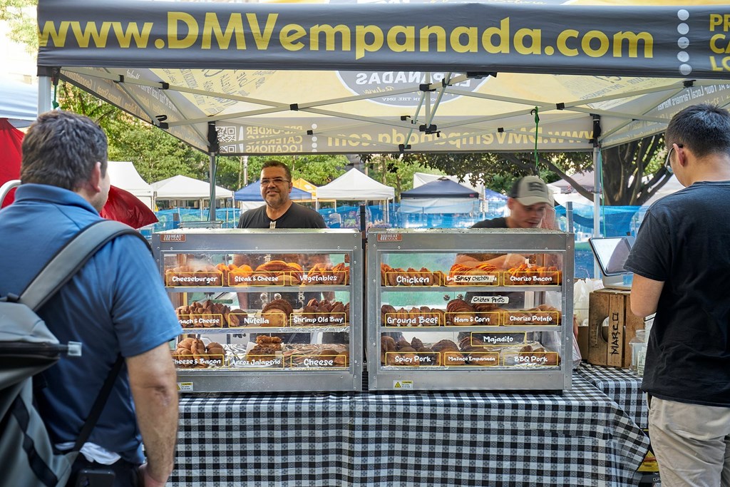 A food stand with a menu on the table.